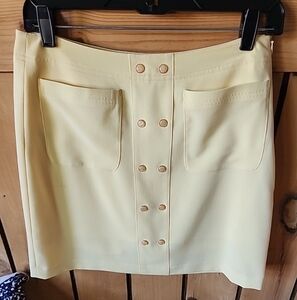 Ep Pro Womens yellow golf skort with pockets and decorative buttons.  Size 4.